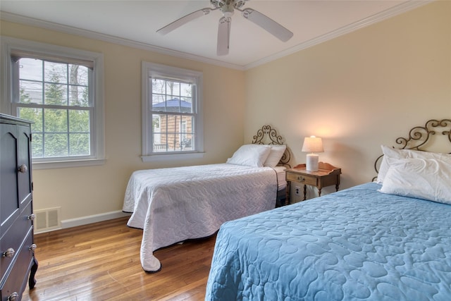 555 Three Waters Ln, Orient, NY 11957 - bedroom featuring visible vents, a ceiling fan, ornamental molding, light wood-type flooring, and baseboards