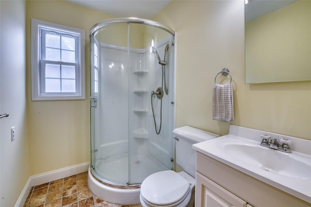 555 Three Waters Ln, Orient, NY 11957 - bathroom with baseboards, toilet, vanity, and a stall shower