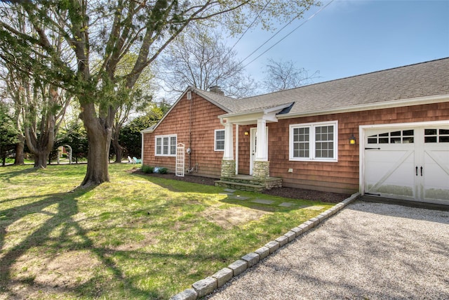 555 Three Waters Ln, Orient, NY 11957 - ranch-style home featuring a chimney, a front lawn, a shingled roof, and a garage