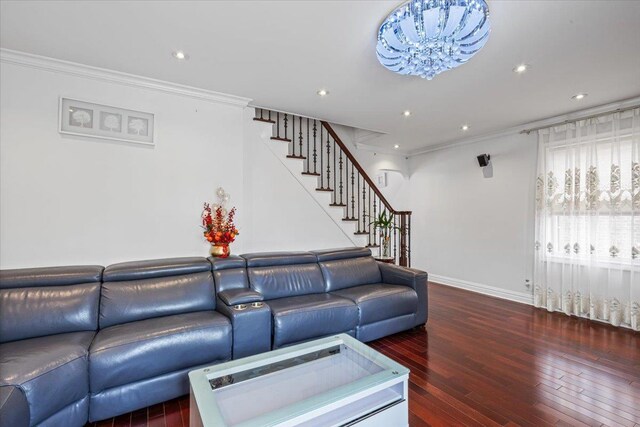 living room with recessed lighting, ornamental molding, hardwood / wood-style flooring, and stairs