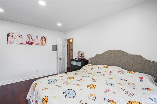 bedroom with recessed lighting, hardwood / wood-style flooring, and baseboards