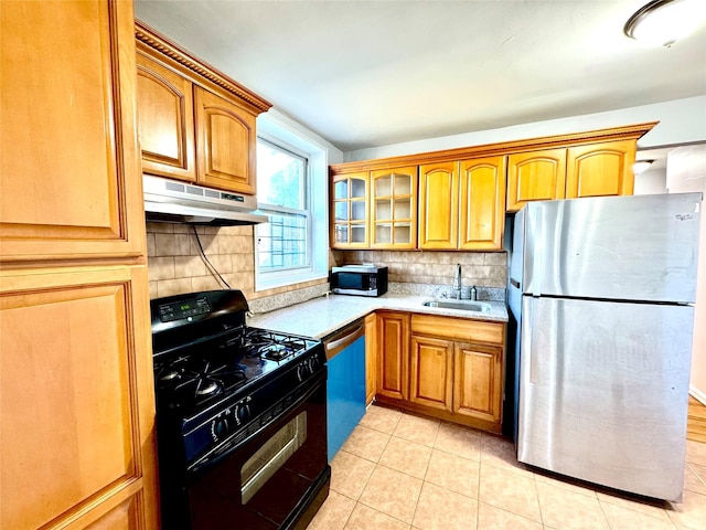 60-11 Broadway Unit 4C, Woodside, NY 11377 - kitchen featuring appliances with stainless steel finishes, under cabinet range hood, a sink, light countertops, and backsplash