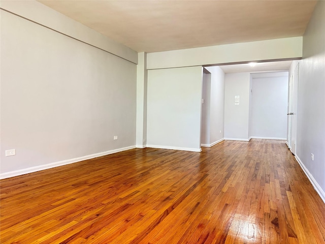 60-11 Broadway Unit 4C, Woodside, NY 11377 - empty room with hardwood / wood-style flooring and baseboards