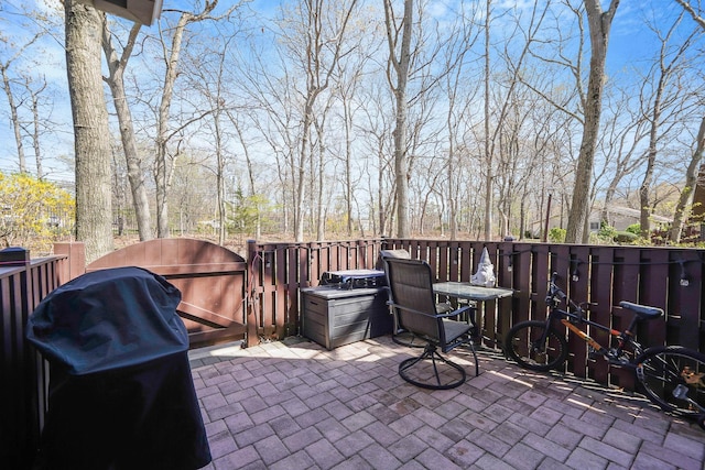 view of patio / terrace featuring area for grilling and a gate