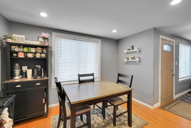 dining area featuring recessed lighting, baseboards, and light wood-style floors