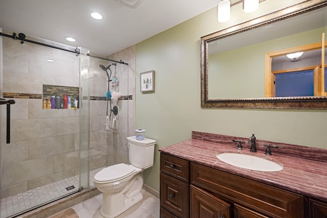 bathroom with recessed lighting, tile patterned flooring, toilet, vanity, and a stall shower
