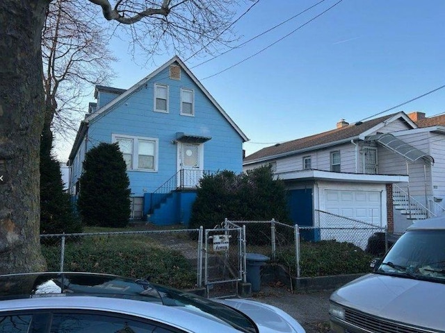 2933 Tenbroeck Ave, Bronx, NY 10469 - view of front facade featuring an attached garage, fence, and a gate