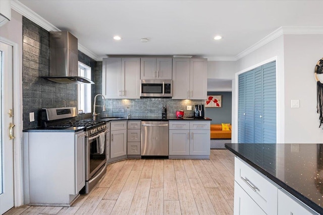 31 Arthur St, Baldwin, NY 11510 - kitchen featuring ornamental molding, a sink, light wood-style floors, decorative backsplash, and appliances with stainless steel finishes