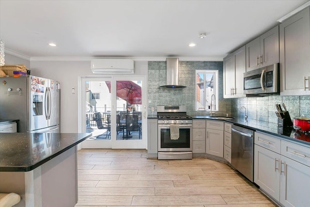 31 Arthur St, Baldwin, NY 11510 - kitchen featuring crown molding, a sink, gray cabinets, stainless steel appliances, and wall chimney exhaust hood