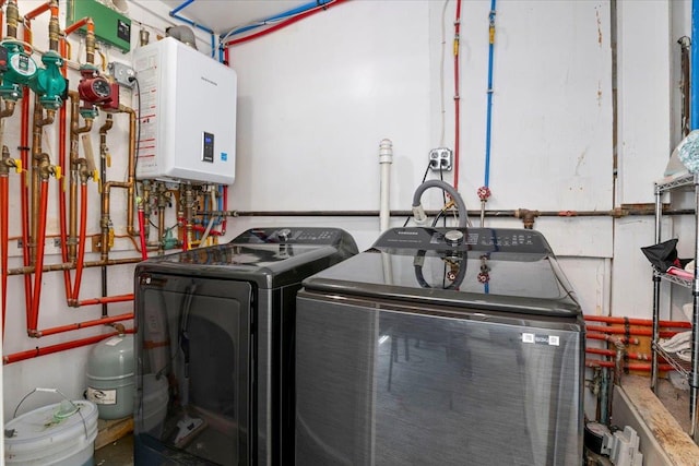 31 Arthur St, Baldwin, NY 11510 - washroom featuring separate washer and dryer, water heater, and laundry area