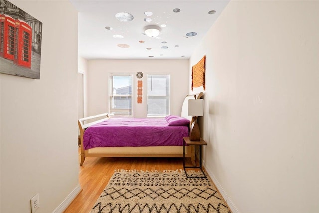 31 Arthur St, Baldwin, NY 11510 - bedroom with light wood-style flooring and baseboards