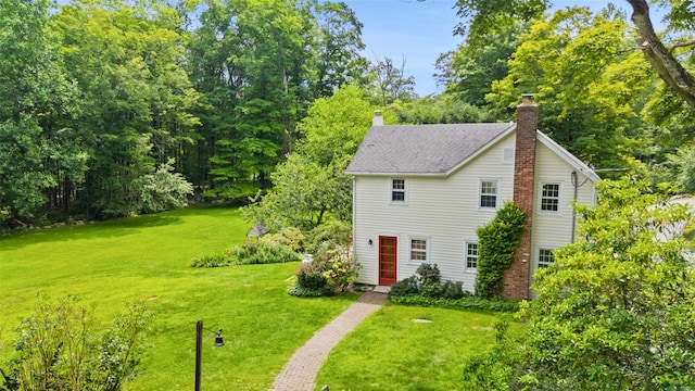 100 E St, South Salem, NY 10590 - view of front of house with a chimney, a front lawn, and roof with shingles