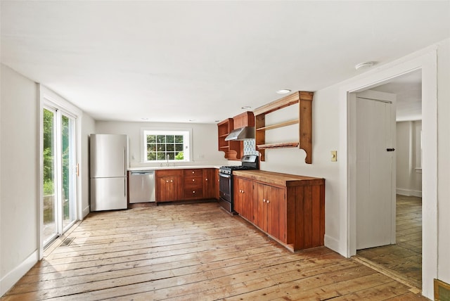 100 E St, South Salem, NY 10590 - kitchen with appliances with stainless steel finishes, light wood-style floors, open shelves, ventilation hood, and light countertops