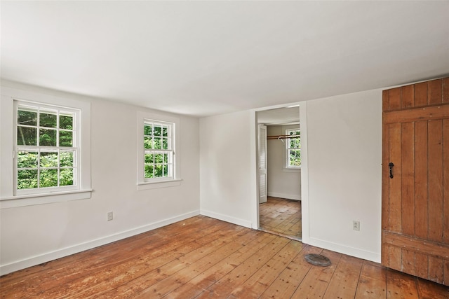 100 E St, South Salem, NY 10590 - unfurnished bedroom featuring light wood-type flooring and multiple windows
