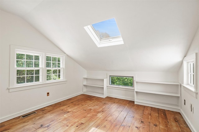 100 E St, South Salem, NY 10590 - bonus room with plenty of natural light, vaulted ceiling, hardwood / wood-style floors, a skylight, and built in shelves