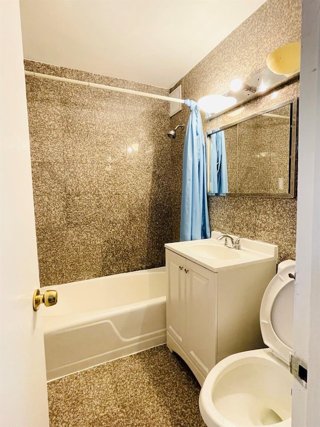 full bathroom with toilet, shower / bath combo, and vanity