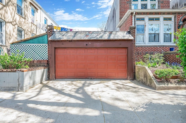 garage featuring driveway