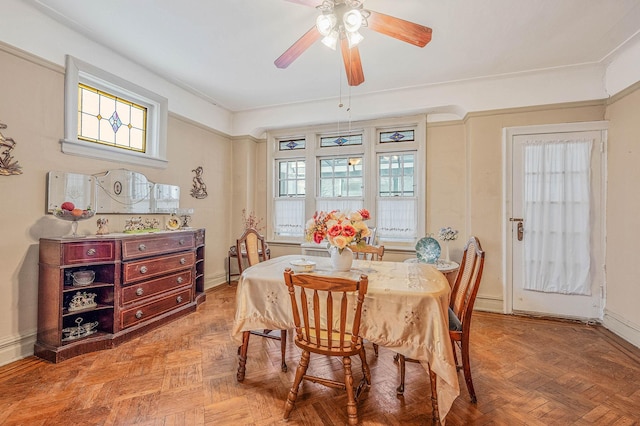 dining space featuring ceiling fan