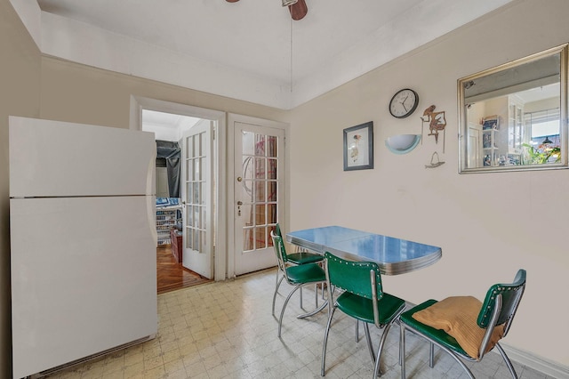 dining area featuring light floors and ceiling fan