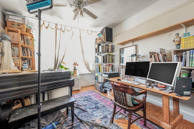 office featuring baseboards and a ceiling fan