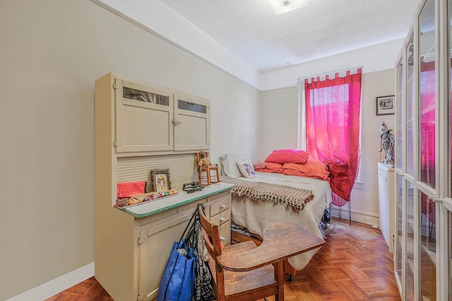 bedroom featuring baseboards