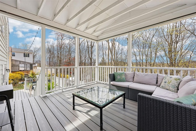 sunroom featuring an outdoor living space