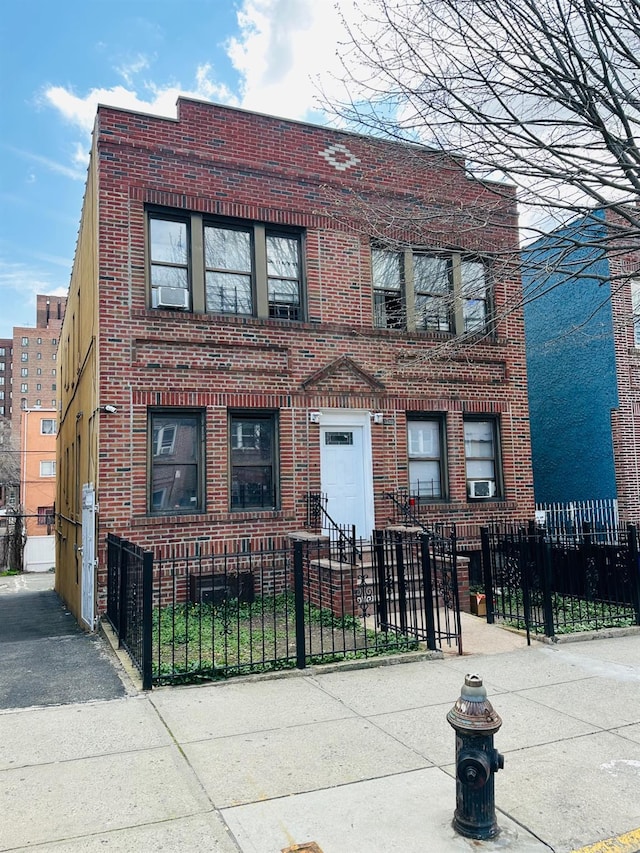 1420 Leland Ave, Bronx, NY 10460 - view of front of house with brick siding and a fenced front yard