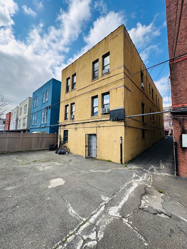 1420 Leland Ave, Bronx, NY 10460 - view of building exterior with cooling unit and fence