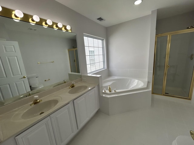 full bathroom featuring toilet, a stall shower, and a sink