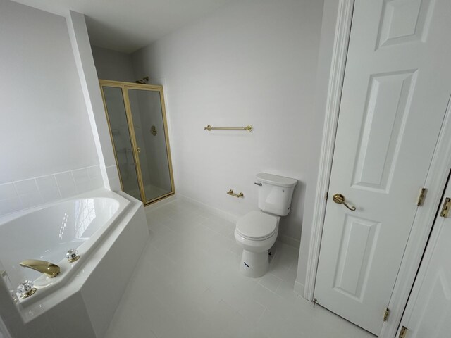 full bathroom featuring a shower stall, tile patterned flooring, a garden tub, and toilet