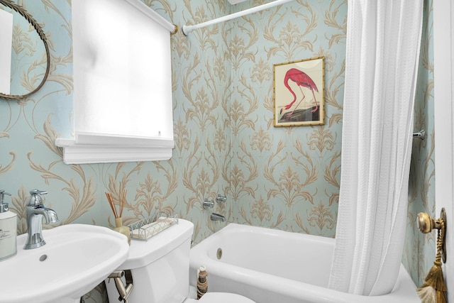 full bathroom with a sink, toilet, and wallpapered walls