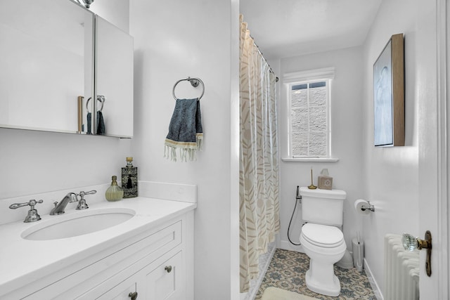 full bathroom featuring vanity, toilet, radiator, baseboards, and curtained shower