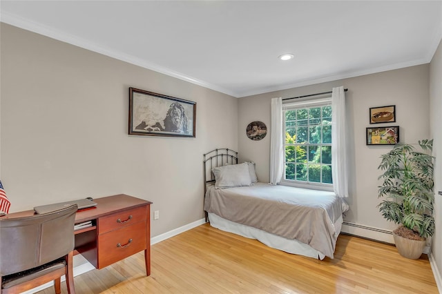 bedroom featuring recessed lighting, crown molding, baseboards, a baseboard radiator, and light wood-style flooring