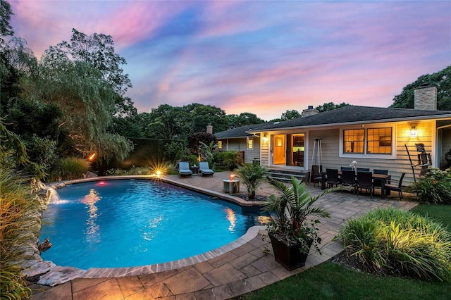 outdoor pool featuring a patio