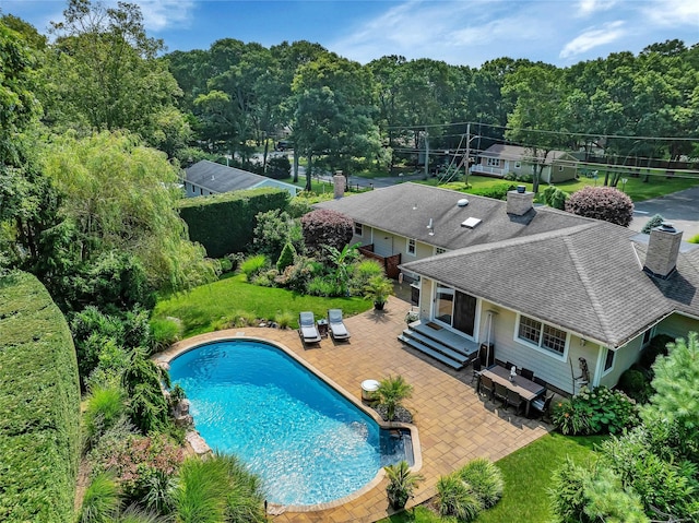 outdoor pool with a patio