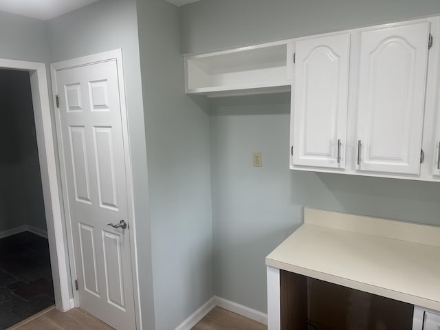 interior space featuring baseboards