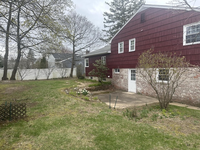 view of yard featuring fence and a patio