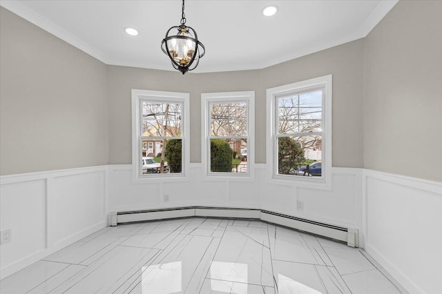 spare room featuring a healthy amount of sunlight, a wainscoted wall, an inviting chandelier, and recessed lighting