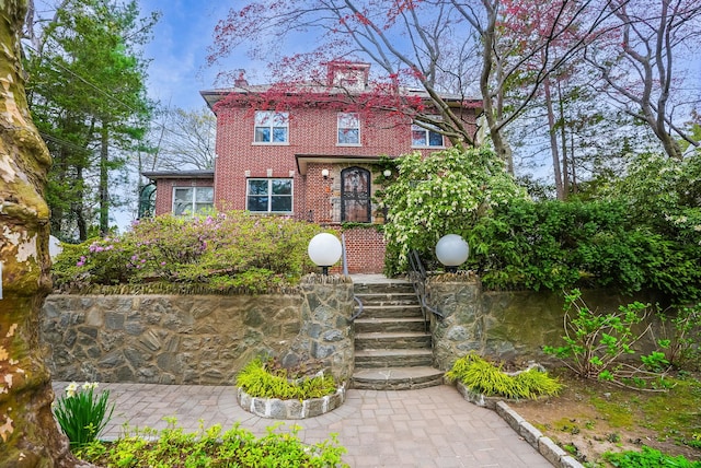 5235 Netherland Ave, Bronx, NY 10471 - view of front of house featuring brick siding and a chimney