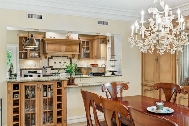 5235 Netherland Ave, Bronx, NY 10471 - dining area with ornamental molding and a chandelier