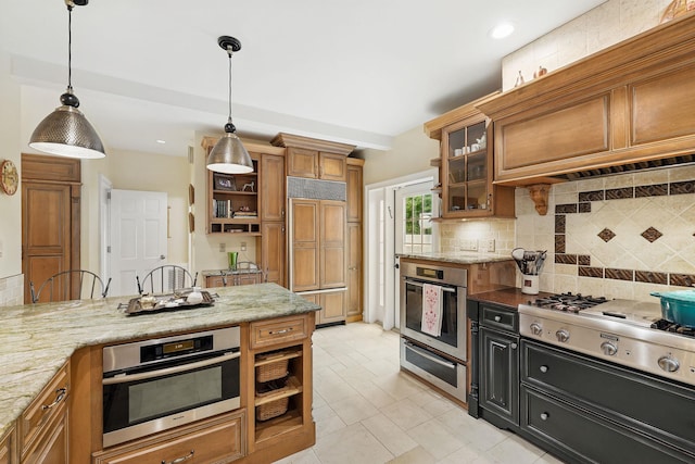 5235 Netherland Ave, Bronx, NY 10471 - kitchen featuring stainless steel appliances, a warming drawer, brown cabinets, backsplash, and recessed lighting