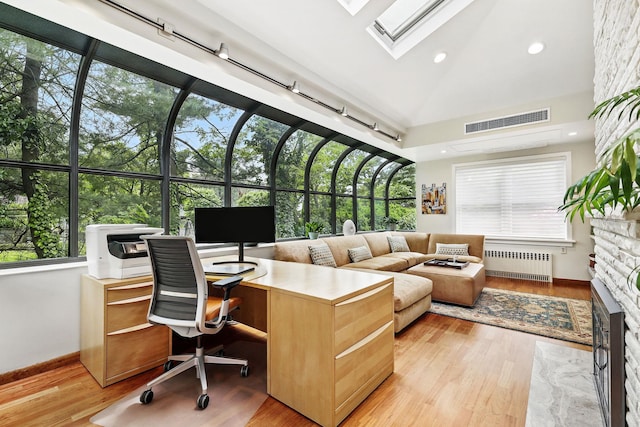5235 Netherland Ave, Bronx, NY 10471 - office space featuring radiator heating unit, baseboards, light wood-style flooring, plenty of natural light, and lofted ceiling