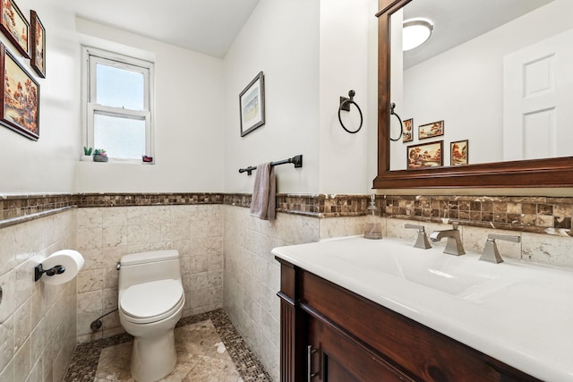5235 Netherland Ave, Bronx, NY 10471 - half bath featuring toilet, vanity, wainscoting, and tile walls