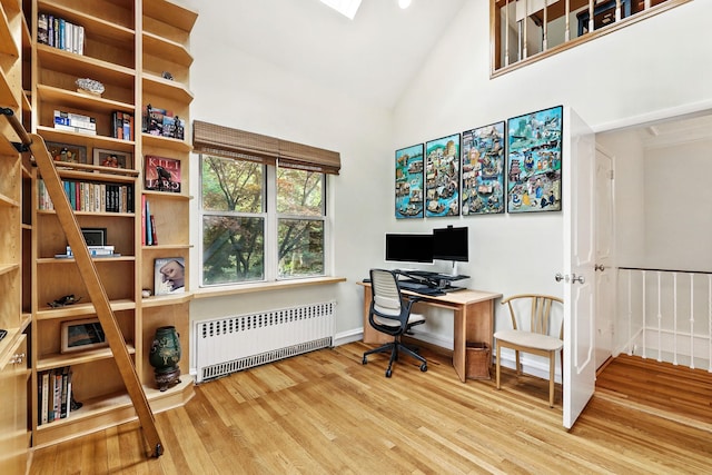 5235 Netherland Ave, Bronx, NY 10471 - office space featuring radiator heating unit, wood finished floors, high vaulted ceiling, and baseboards