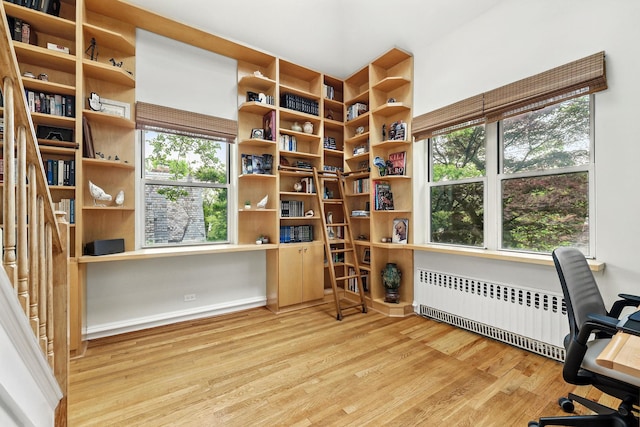 5235 Netherland Ave, Bronx, NY 10471 - office with radiator heating unit, wood finished floors, and built in study area