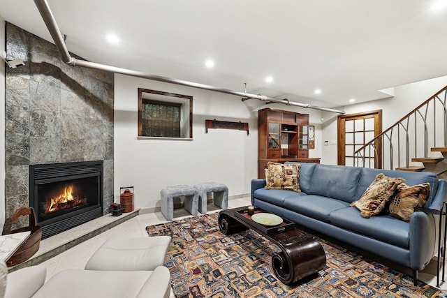 5235 Netherland Ave, Bronx, NY 10471 - tiled living area with recessed lighting, stairs, a tiled fireplace, and baseboards