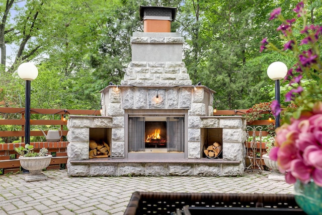 5235 Netherland Ave, Bronx, NY 10471 - view of patio with an outdoor stone fireplace
