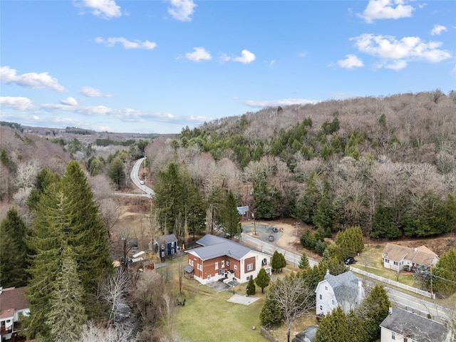 drone / aerial view with a view of trees