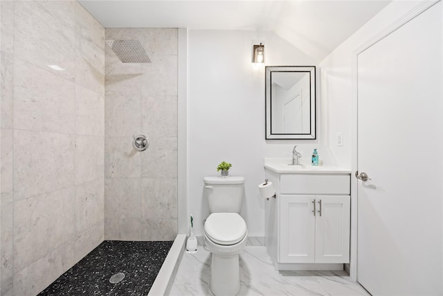 bathroom with vanity, a tile shower, toilet, and marble finish floor