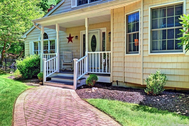 150 N Woods Dr, Wading River, NY 11792 - entrance to property with a porch and a chimney